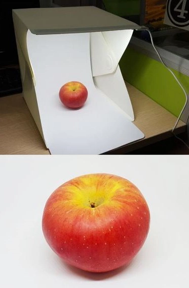 Mini Fotobox mit einem beleuchteten Apfel